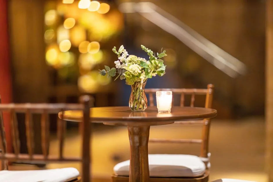 Low floral arrangements on a restaurant table