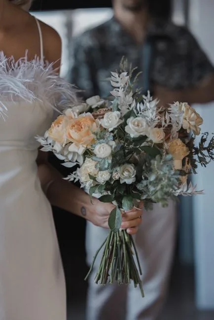 A bouquet resting beside a ceremony installation