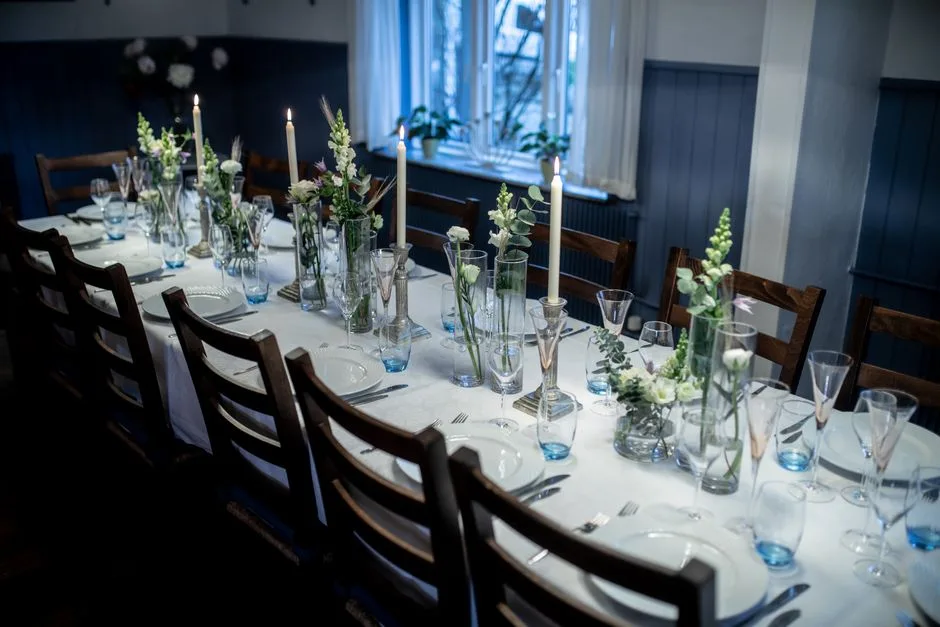 A head table set with twelve low arrangements