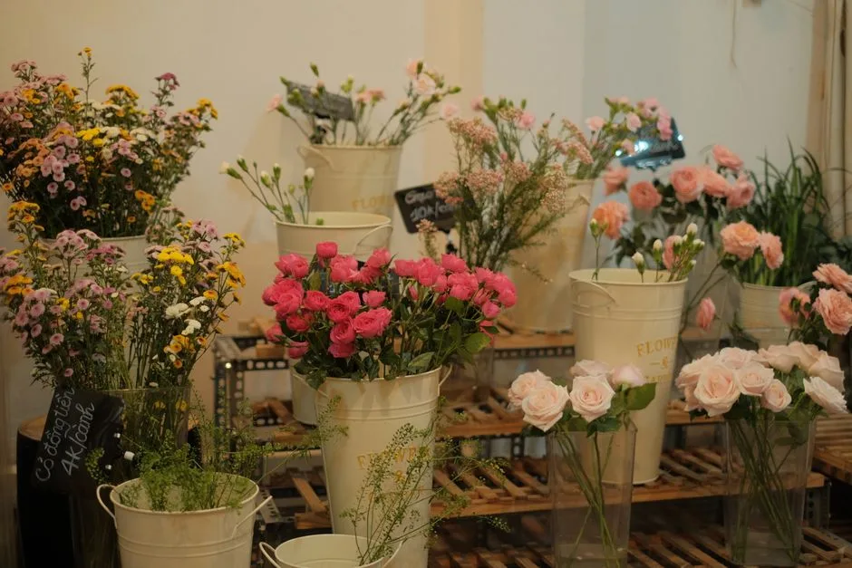 Buckets of flowers in a cold room