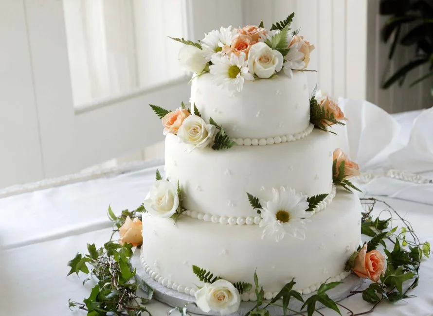 Fresh flowers placed on a wedding cake
