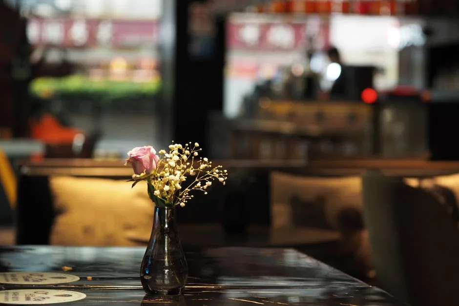 A floral arrangement on a restaurant bar