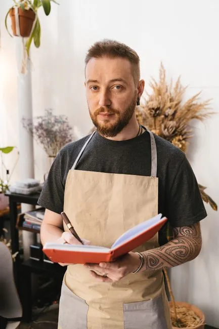 Portrait of a florist loading a van